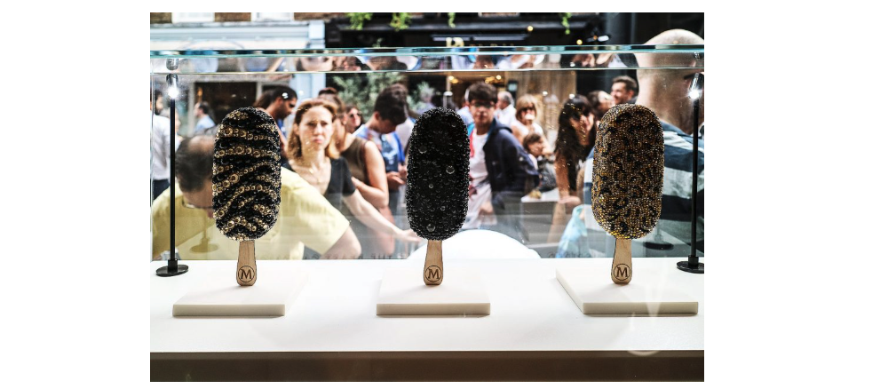 three bejewelled Magnums behind glass