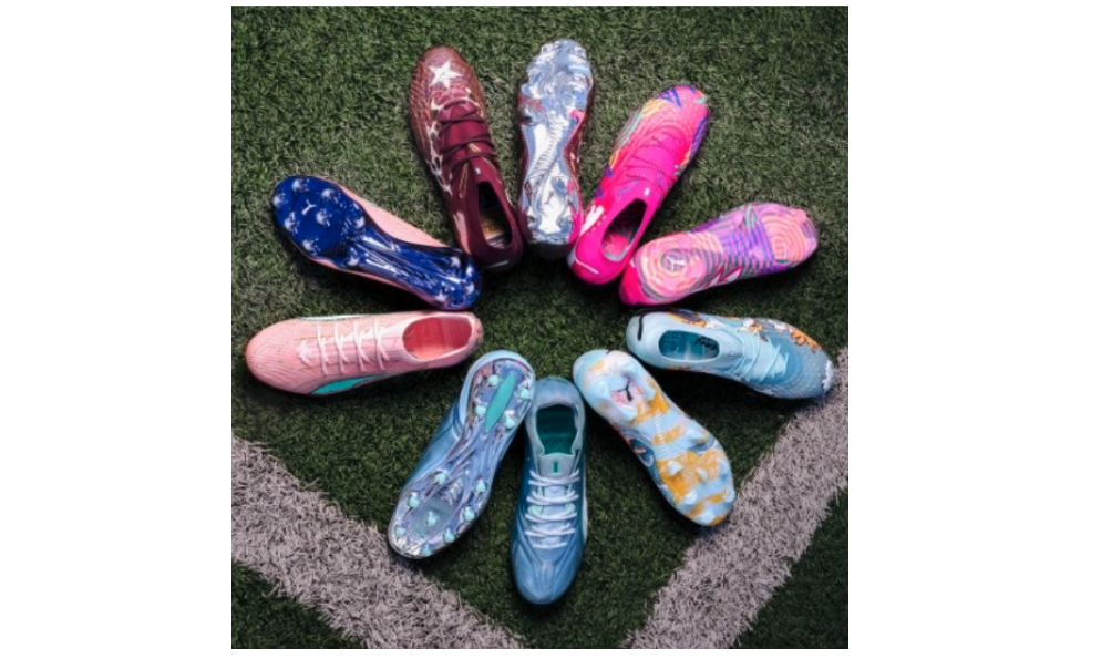Exclusive football boots sit on grass in a circle. 