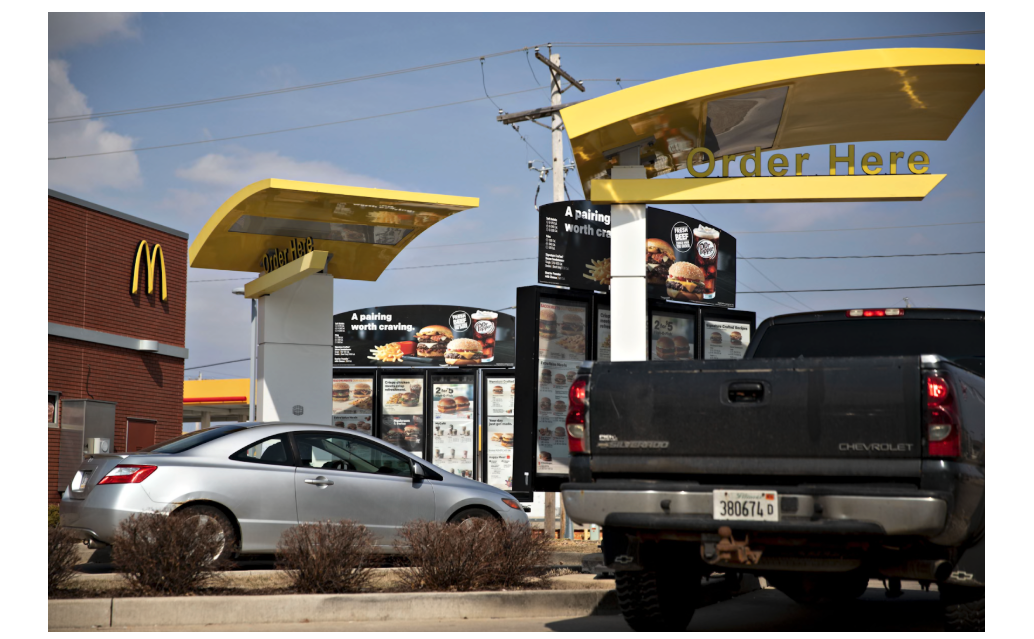 cars line up for a McDonald’s drive-thru