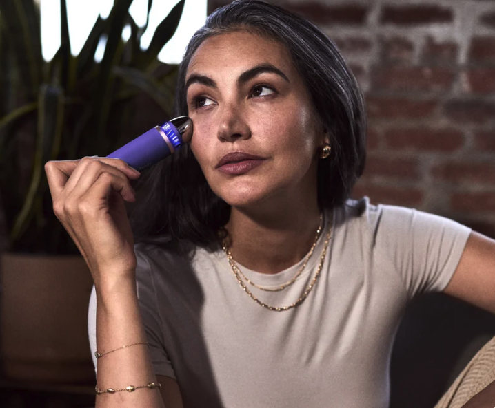 Therabody's New Theraface Depuffing Wand in indigo campaign image