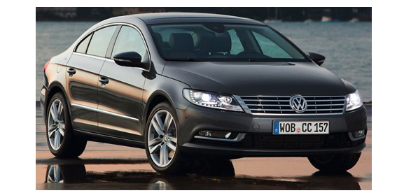 a black, four door Volkswagen sedan 