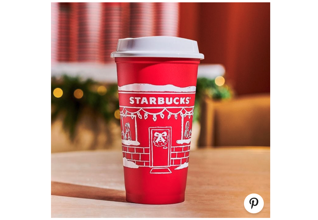 Red cup with festive storefront illustration.