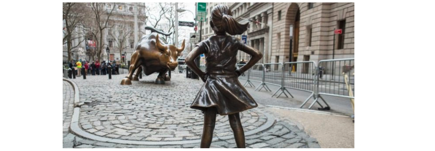 Girl stands down bull on Wall Street. 